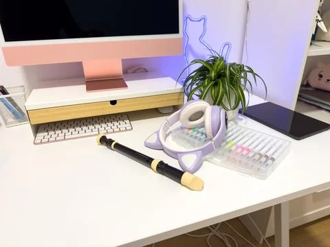 Creative Workspace with Desktop Computer, Recorder Flute and Purple Headphone Stock Photos