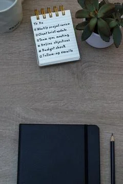 Creative workspace with to-do list, planner and plant Stock Photos
