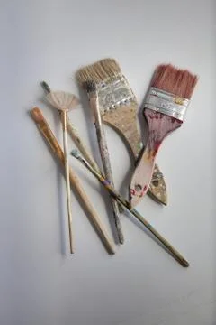 Creative workspace paint brushes randomly placed Stock Photos