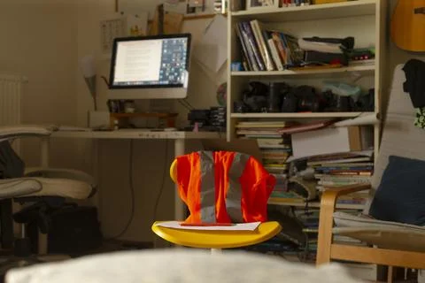 Creative workspace scene. Desk setup with glowing screen and open notebook 스톡 사진