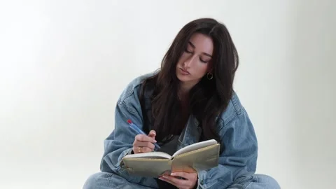 Creative writing and self-reflection concept, young woman writing in notebook Stock Footage 337005891
