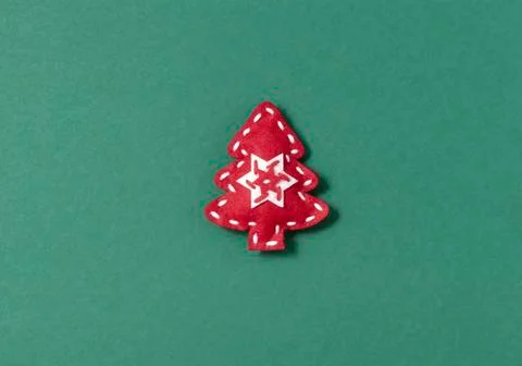 Creative Xmas minimal flat lay composition with handmade red felt Christmas tree Stock Photos