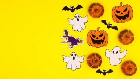 Creative yellow background with copy space and Halloween stickers. Flat lay Stock Illustration