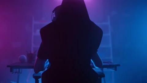 A creative young computer gamer is sitting in front of a screen. Stock Footage 169377144