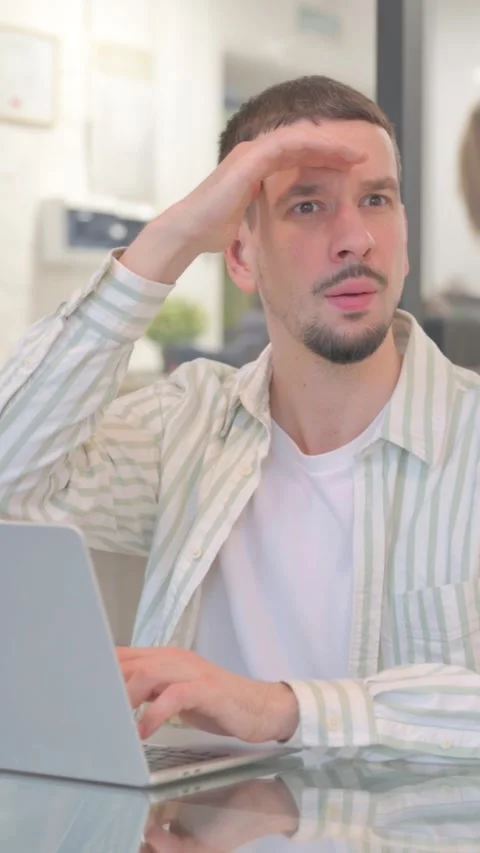 Creative Young Man Searching New Opportunity while Working in Office, vertical Video stock 325563958
