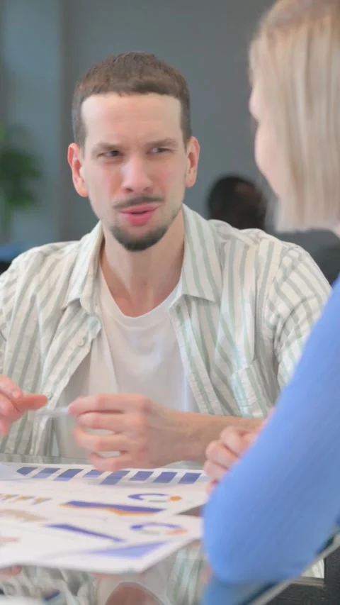 Creative Young Man Talking with Teammates in Meeting, vertical video Video stock 325563404