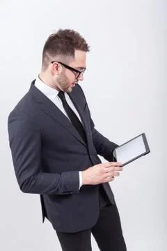 Creative young programmer in a business suit with a tie and sung Stock Photos