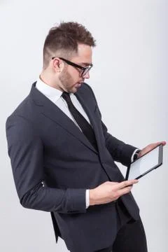 Creative young programmer in a business suit with a tie and sung 스톡 사진