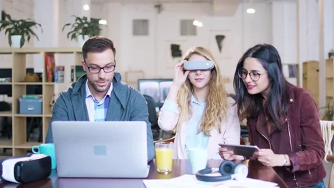 Creative Young Team Man And Women Coworkers Testing Vr AR Mr Headset Virtual Stock Footage 77408545