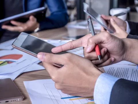 Creative young using tablet computer at the meeting Stock Photos