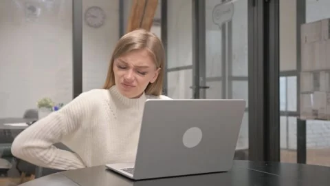 Creative Young Woman having Back Fatigue and Pain at Workspace Stock Footage 303880096
