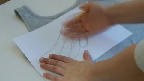 Creative young woman prints pattern on the shirt. Stock Footage 82782031