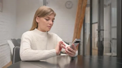 Creative Young Woman Typing Message on Phone Video stock 303880916