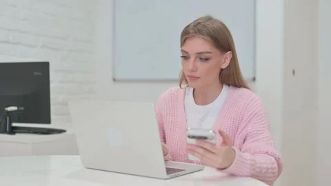 Creative Young Woman Using Multiple Digital Devices for Work Video stock 309510381