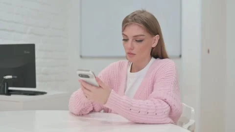 Creative Young Woman Using Smartphone Video stock 309510606
