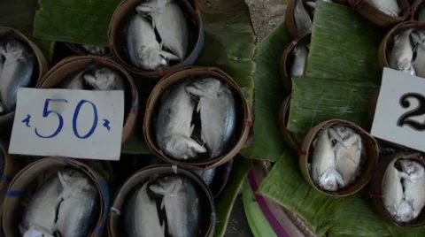 Creatively packed fish in small baskets at a fish market Stock Footage 40647527