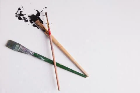 Creatively placed paint brushes paint splatter Stock Photos