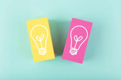 Creativity and fresh idea concept. Light bulbs drawn on yellow and pink Stock Photos