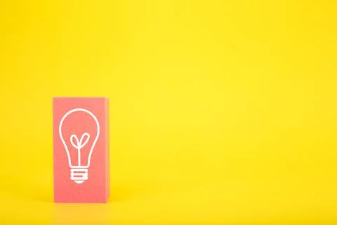 Creativity and idea concept. Light bulb drawn on pink rectangle on bright yellow Stock Photos