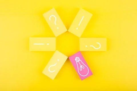Creativity and new ideas concept. Flower made of tablets with question signs and Stock Photos