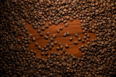 Creativity composition of brown roasted coffee beans. Can be used as background. Stock Photos