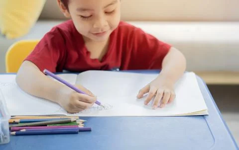 Creativity concept. Adorable nice child in domestic clothes having fun, enj.. Stock Photos