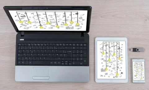 Creativity concept on different information technology devices Stock Photos