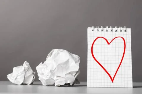 Creativity creative process. crumpled wads and notebook with heart picture... Foto stock