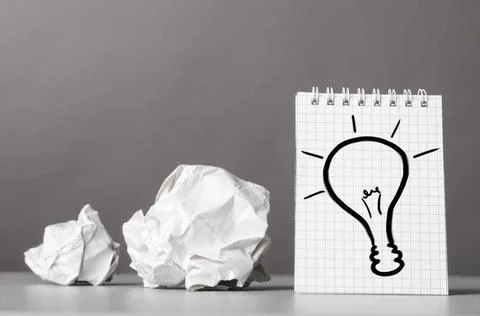 Creativity creative process. crumpled wads and notebook with bulb picture ... 库存照片