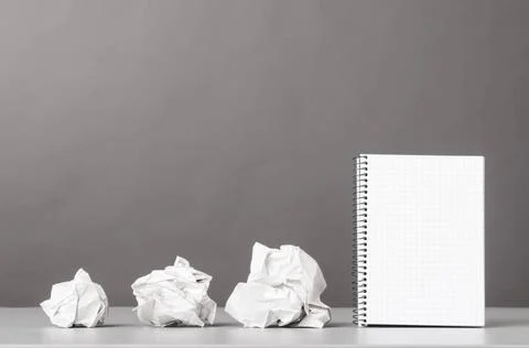 Creativity creative process. crumpled wads and notebook on gray Copyright:... Foto stock