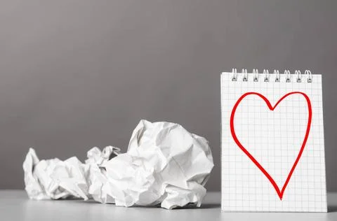 Creativity creative process. crumpled wads and notebook with heart picture... Fotos de archivo