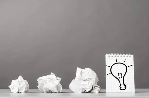Creativity creative process. crumpled wads and notebook with bulb picture ... 库存照片