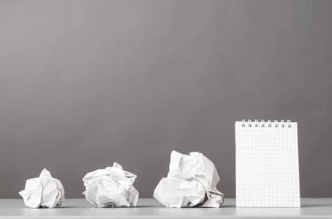 Creativity creative process. crumpled wads and notebook on gray Copyright:... 库存照片