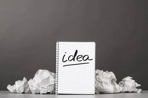 Creativity creative process. crumpled wads and notebook with word idea Cop... 스톡 사진