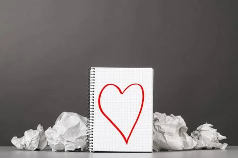 Creativity creative process. crumpled wads and notebook with heart picture... Fotos de archivo