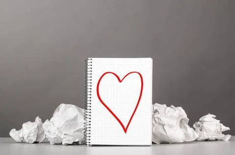 Creativity creative process. crumpled wads and notebook with heart picture... Foto stock