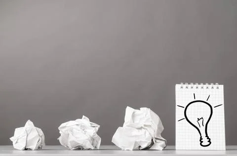 Creativity creative process. crumpled wads and notebook with bulb picture ... Foto stock