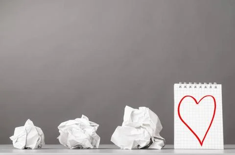 Creativity creative process. crumpled wads and notebook with heart picture... Foto stock