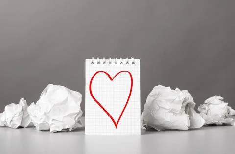 Creativity creative process. crumpled wads and notebook with heart picture... Foto stock