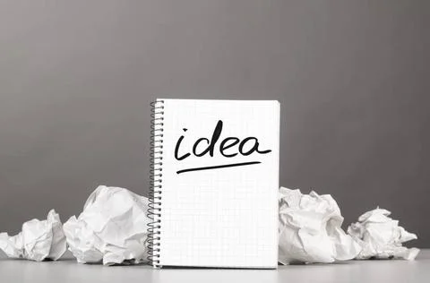 Creativity creative process. crumpled wads and notebook with word idea Cop... Foto stock