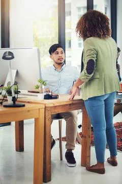 Creativity gets to work. two creative colleagues working together in their Stock Photos