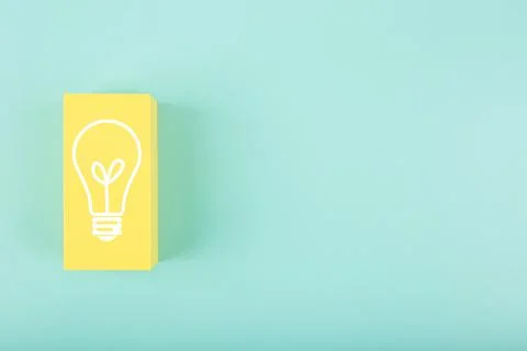 Creativity, innivation and idea concept. Light bulb drawn on yellow rectangle on Stock Photos