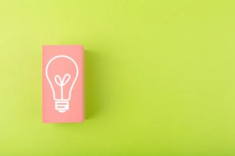 Creativity, innovation and idea concept. Light bulb drawn on pink rectangle on Stock Photos