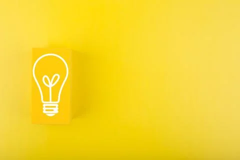 Creativity, innovation and idea concept. Light bulb drawn on yellow rectangle on Stock Photos