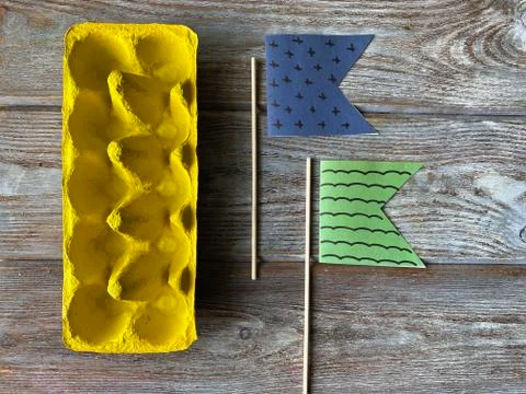 Creativity lesson how to make a children's DIY boat out of a recycling egg bo Stock Photos