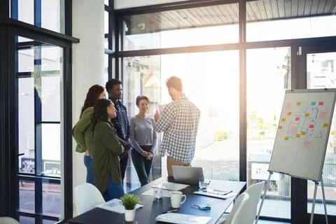 Creativity at work. Shot of a group of colleagues having an office meeting. Stock Photos