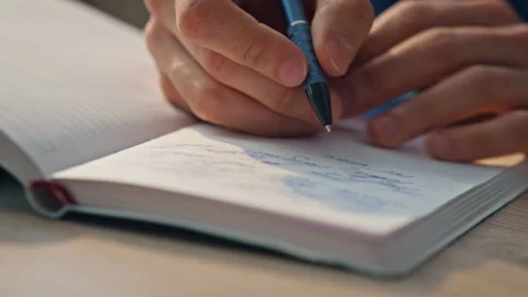 Creator fingers opening notebook table w... | Stock Video | Pond5