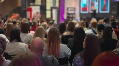 Creators partake in self-improvement lecture, speaker and presentation blurred Stock Footage 269971913