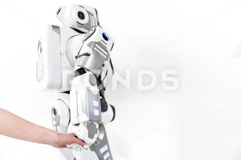 Creature of robotics taking earthborn hand Stock Photos