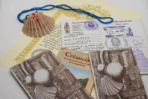 Credentials with retro stamps and a shell from 2006 along the way to Santiago Stock Photos